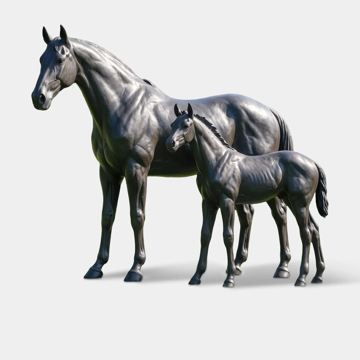 The bronze mare and foal statue stands on a base over green grass, backed by lush leafy trees.