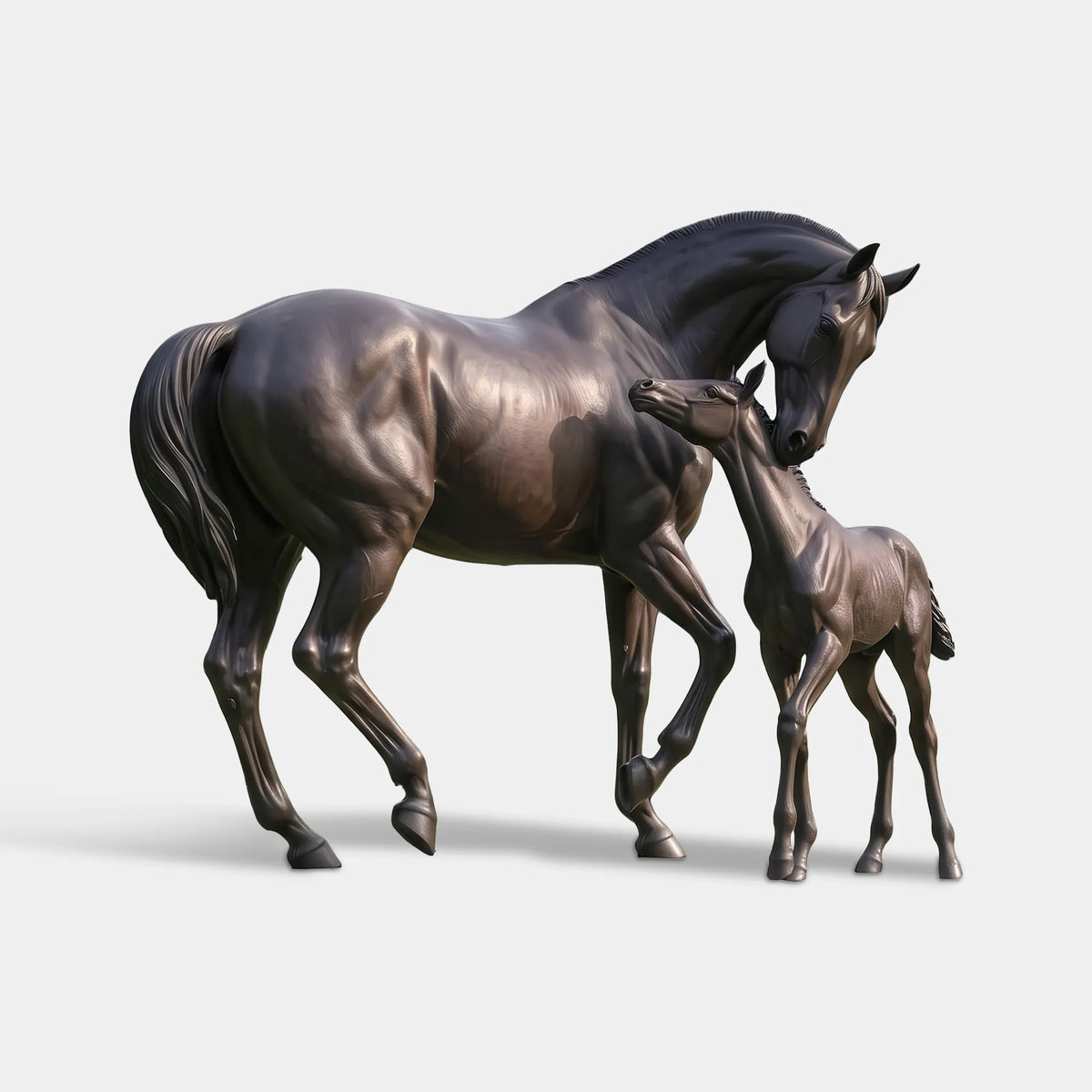 The bronze mare and foal statue stands on a stone pad on green grass.