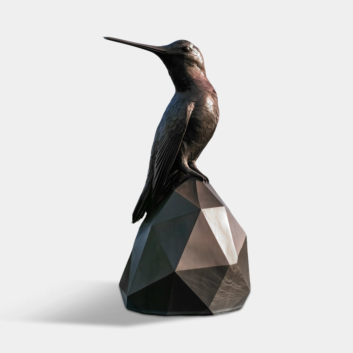 A bronze hummingbird statue sits on a geometric base with a distant city skyline.