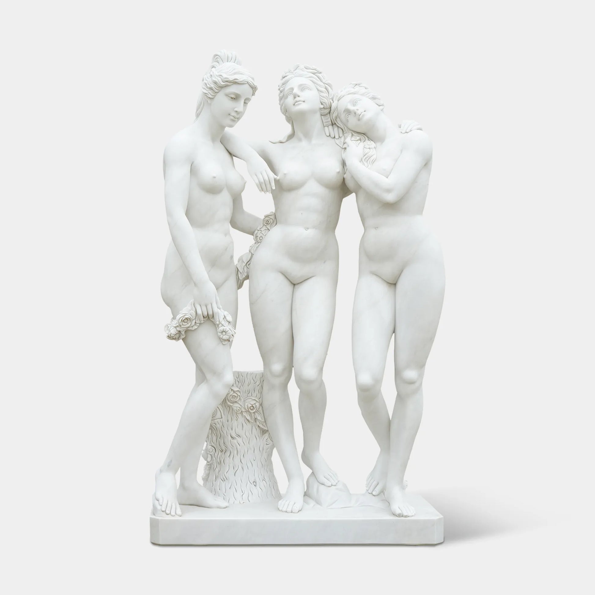 Three Graces marble statue with three intertwined female figures in white marble for garden, patio, courtyard, and terrace corner.