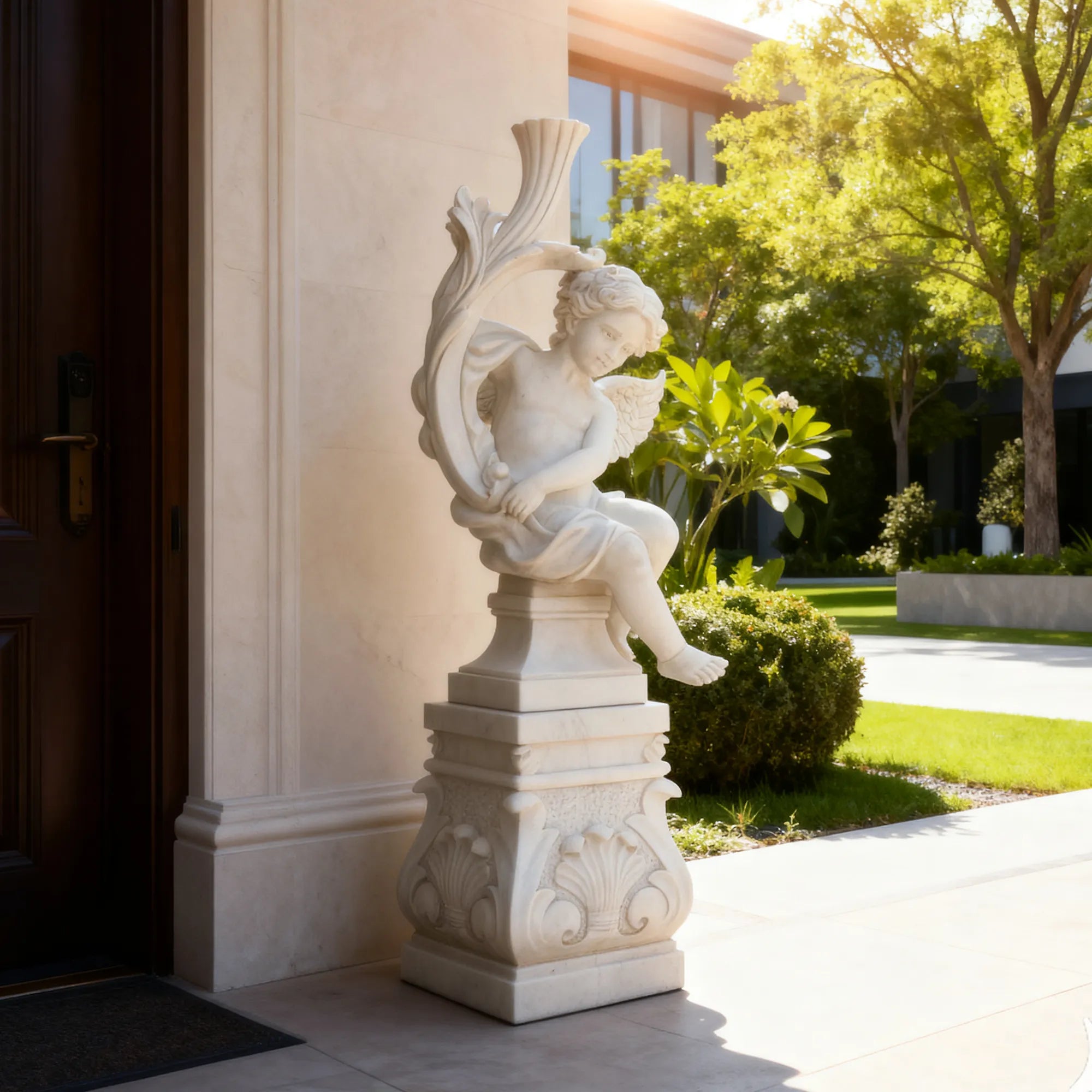 Cute cherub angel statue in white marble with wings sitting pose on base in a garden