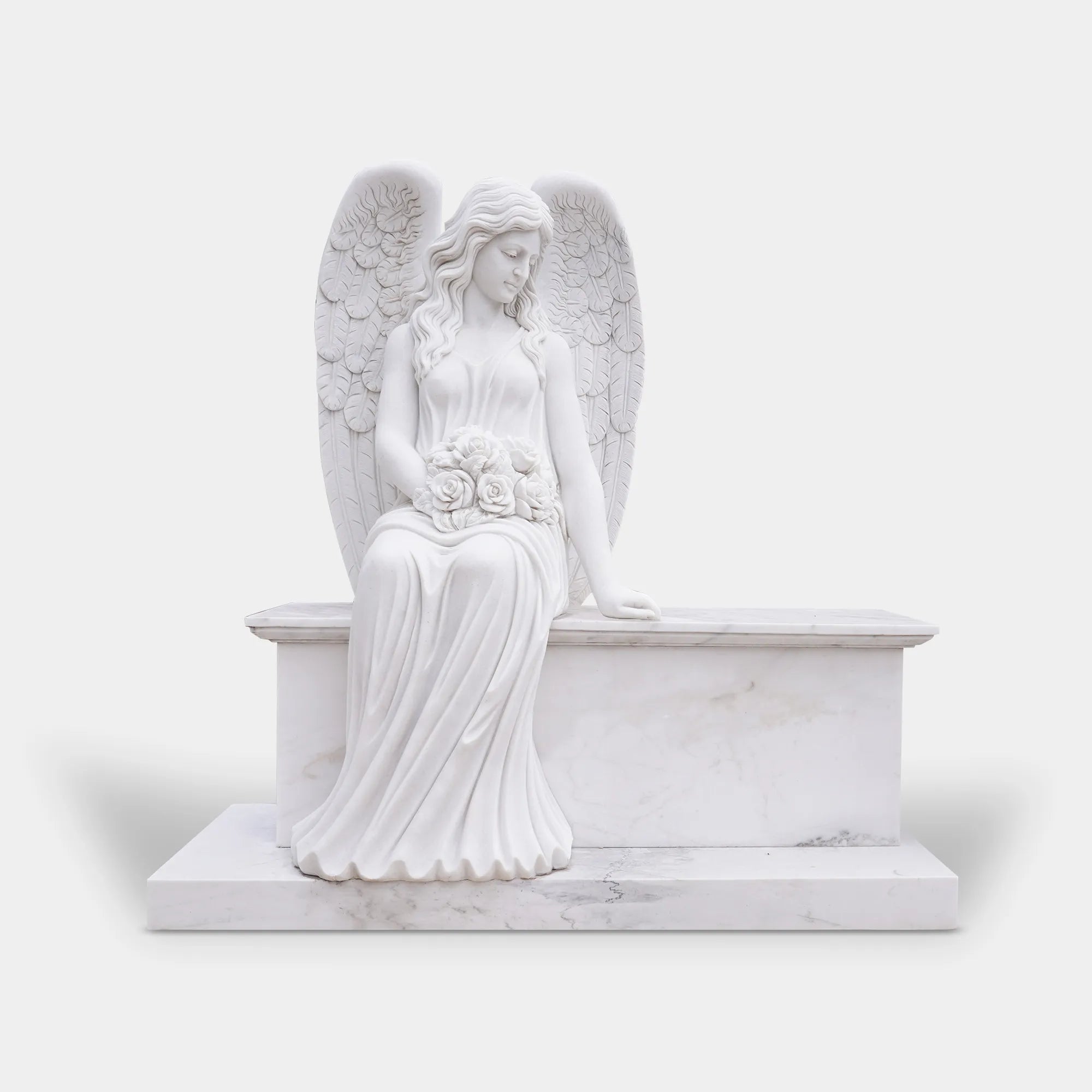 Angel statue in white marble with delicate wings and bouquet, seated on a pedestal in a serene garden surrounded by trees.