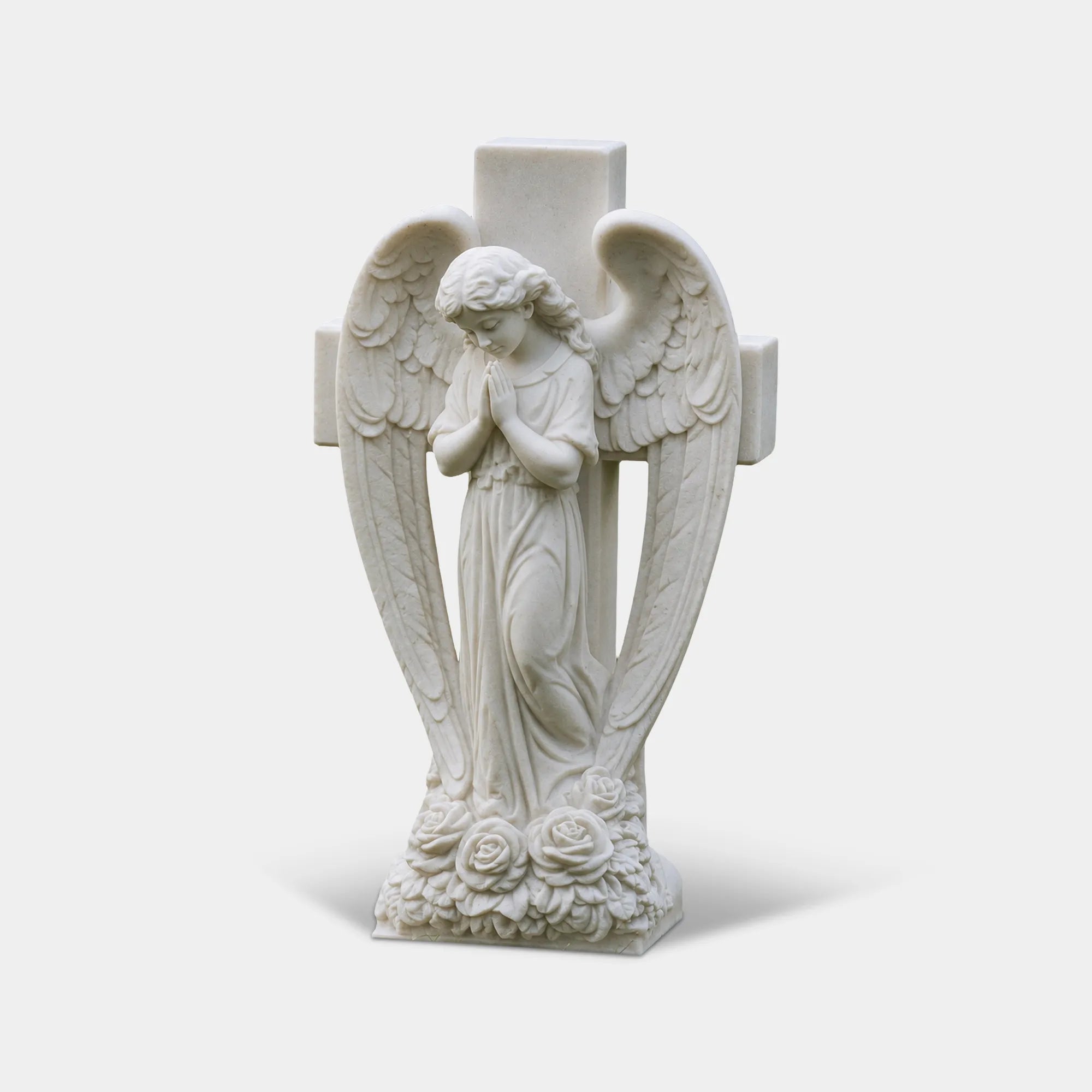 White marble angel sculpture with carved cross behind back for church and memorial garden.
