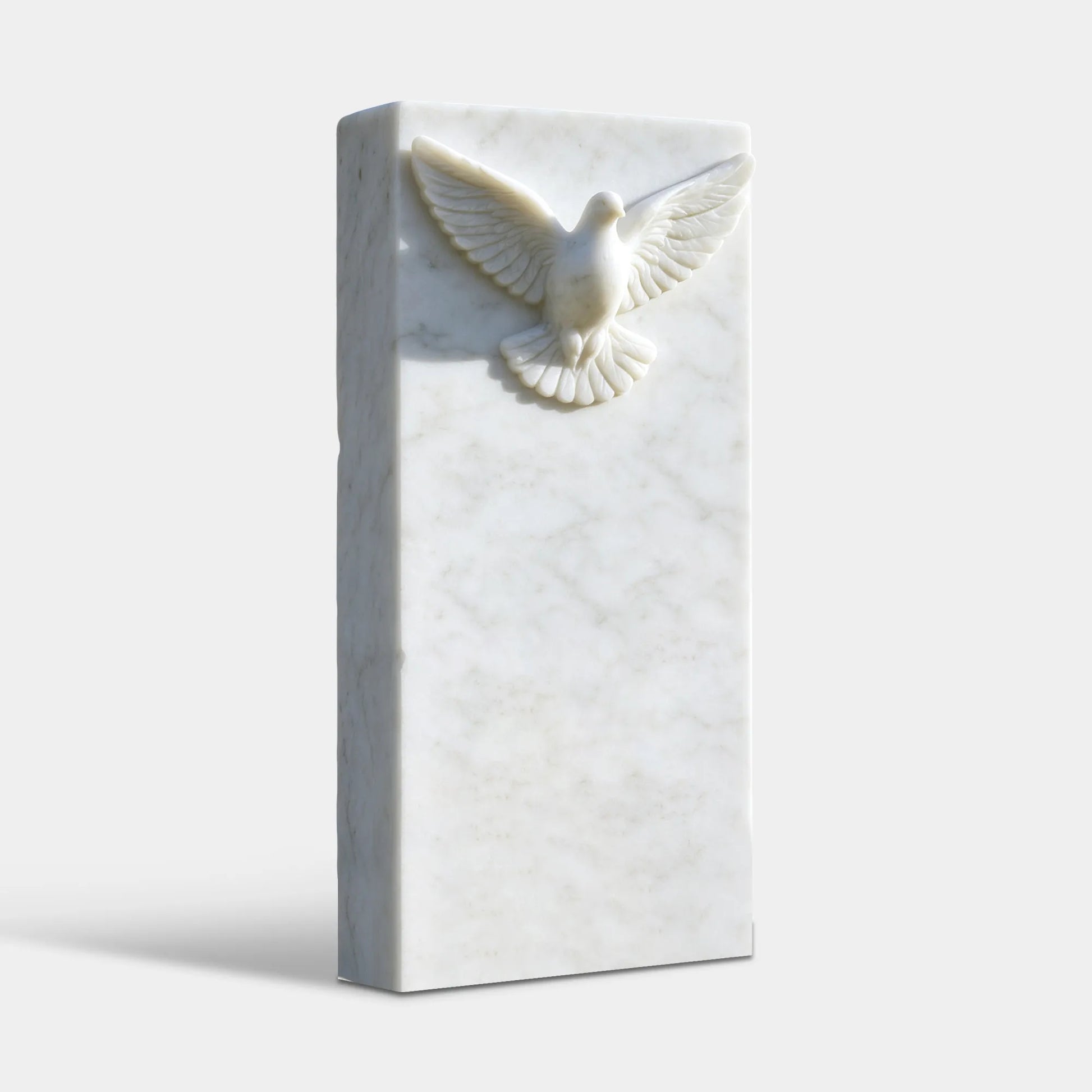 Natural white marble dove memorial sculpture with square headstone and carved dove design.