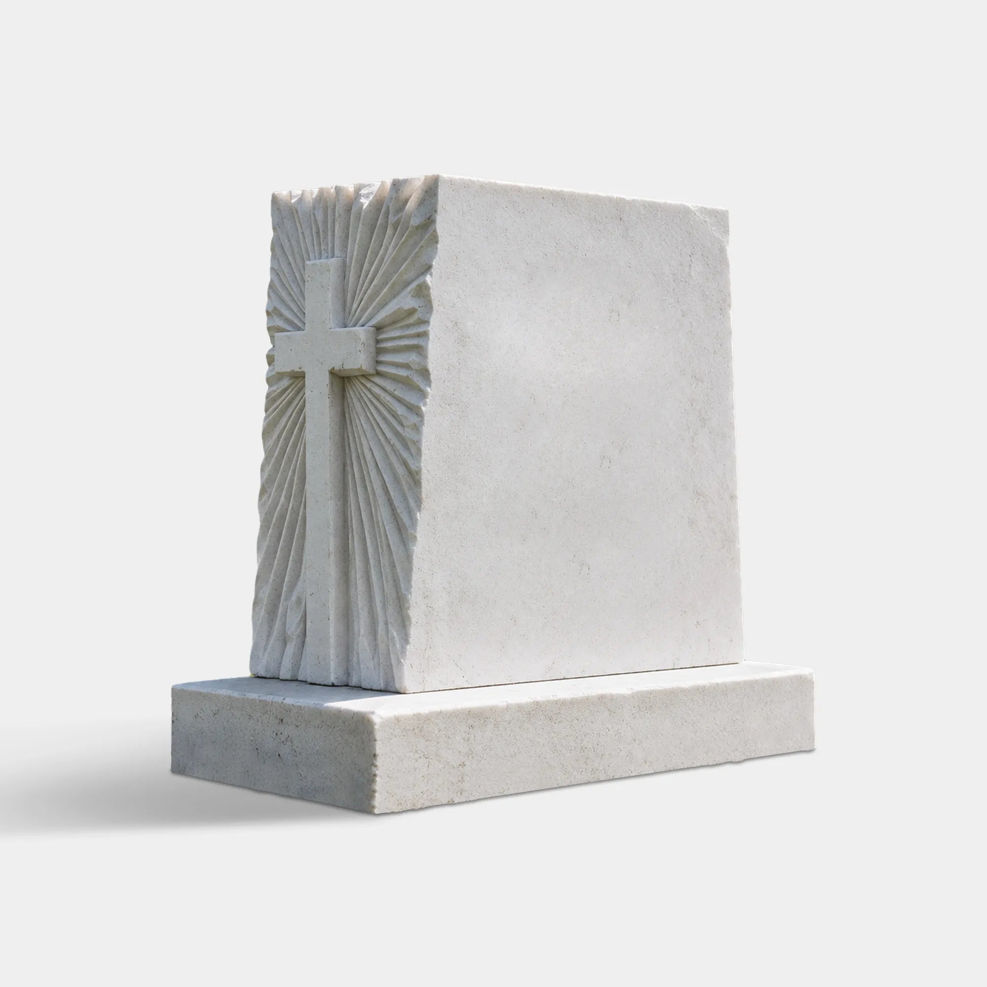 White marble memorial headstone with a hand-carved cross and radiating pattern for cemetery headstone and family grave.