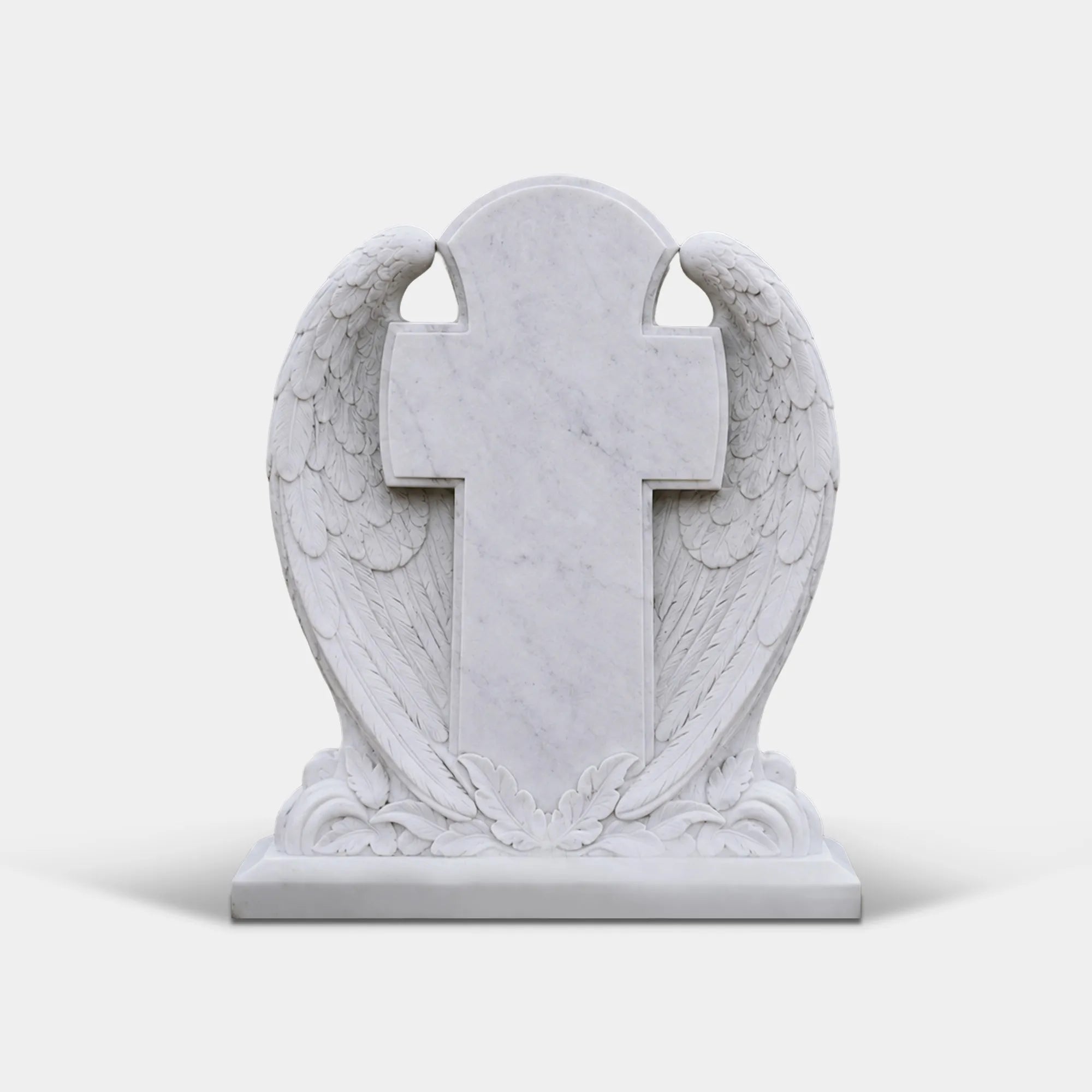 White marble headstone carved with wing wrapping a cross stands on the grass cemetery ground.