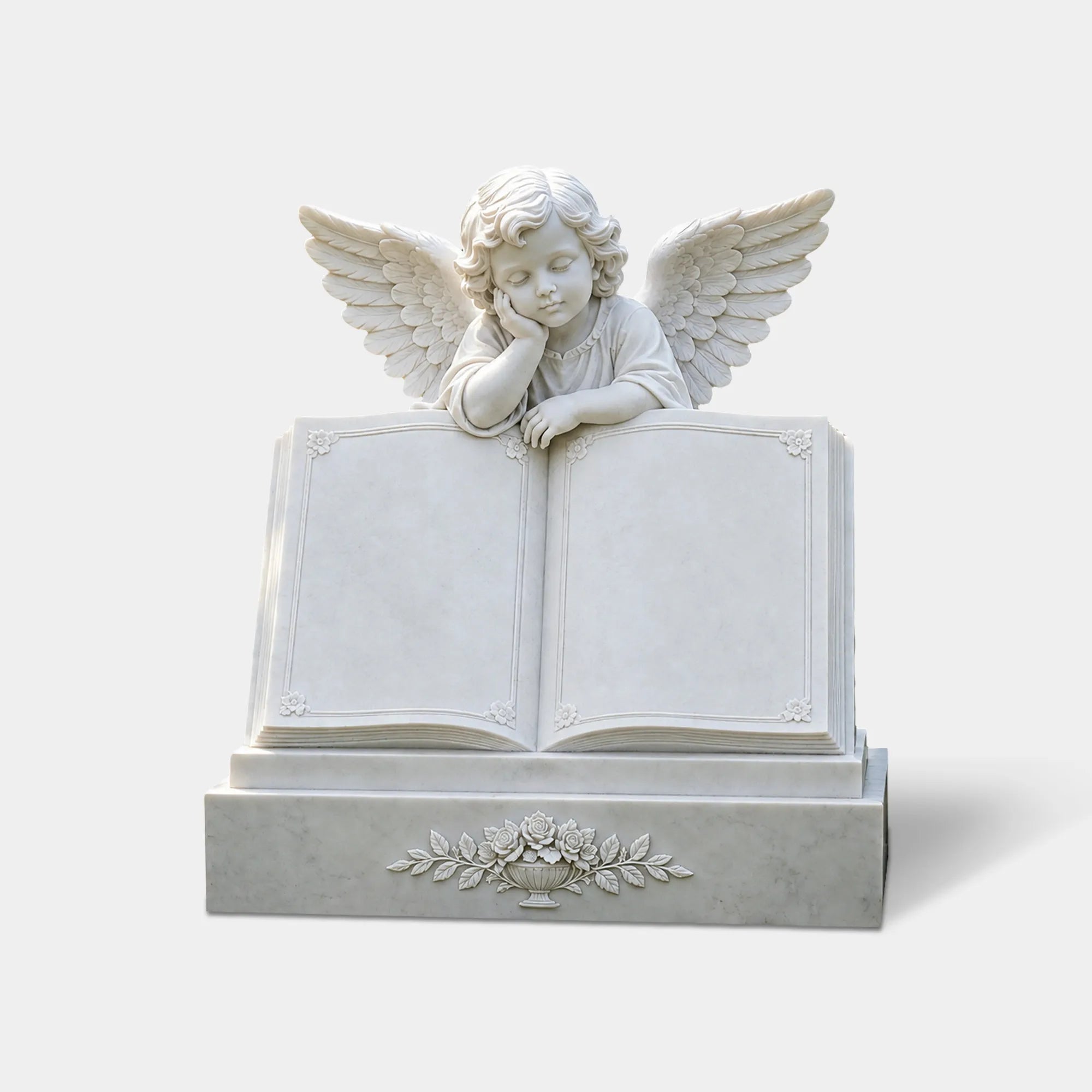 White marble angel memorial statue with angel resting over an open book in a cemetery.