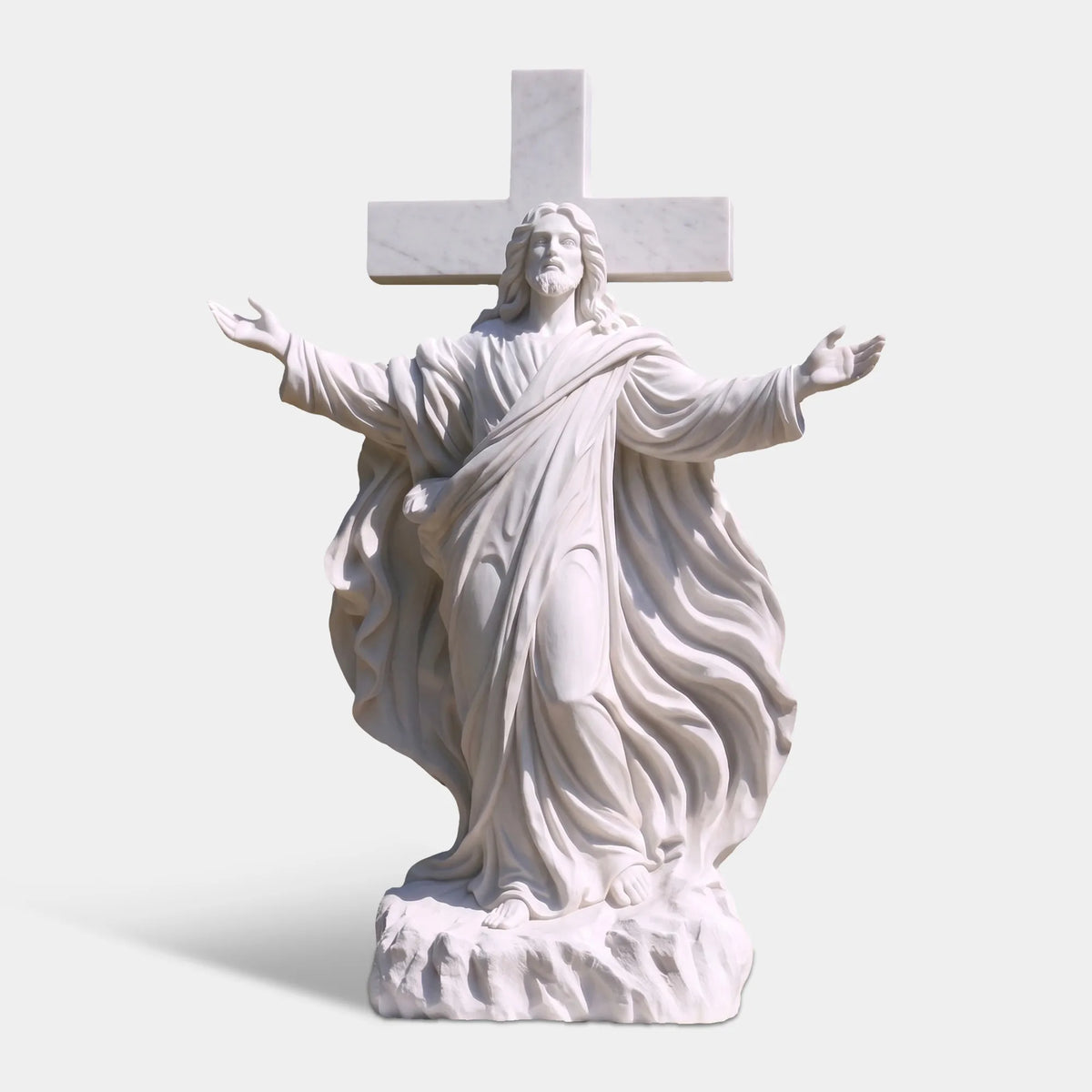 White marble Jesus statue with cross stands on the stone base among trees.