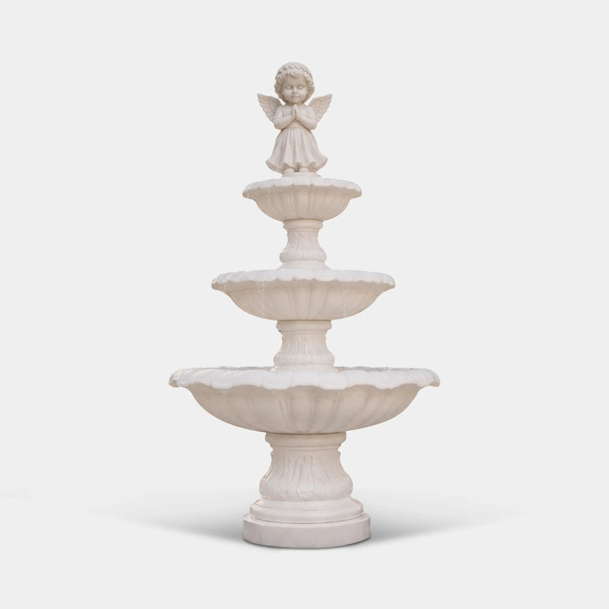 White marble three-tier angel fountain with praying cherub for a poolside courtyard.