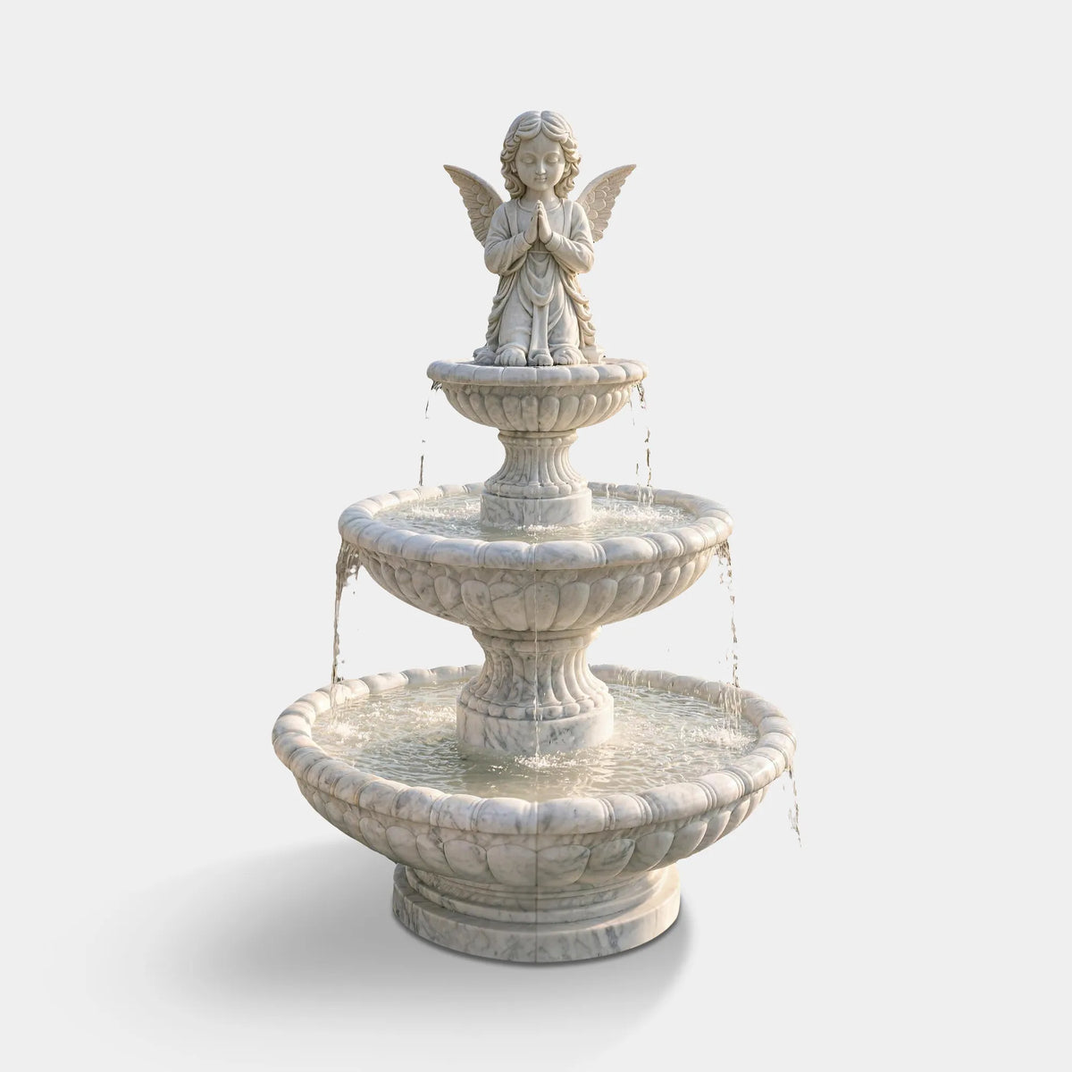 A white marble fountain with angel statue sits on the front lawn of a residential house.