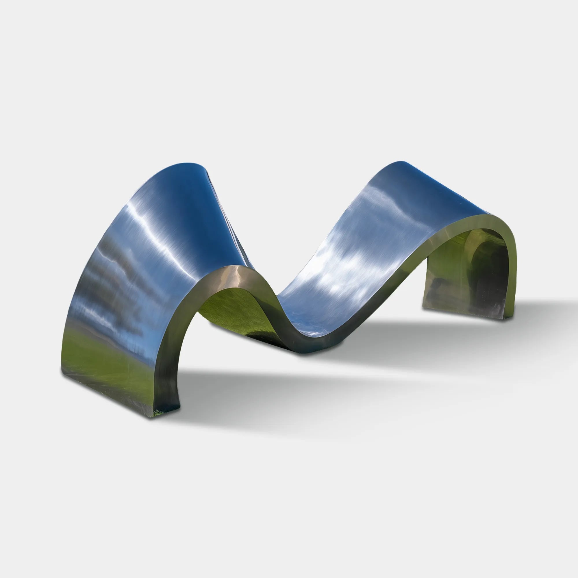 Polished stainless steel wave-shaped abstract sculpture on green lawn near swimming pool and palm trees