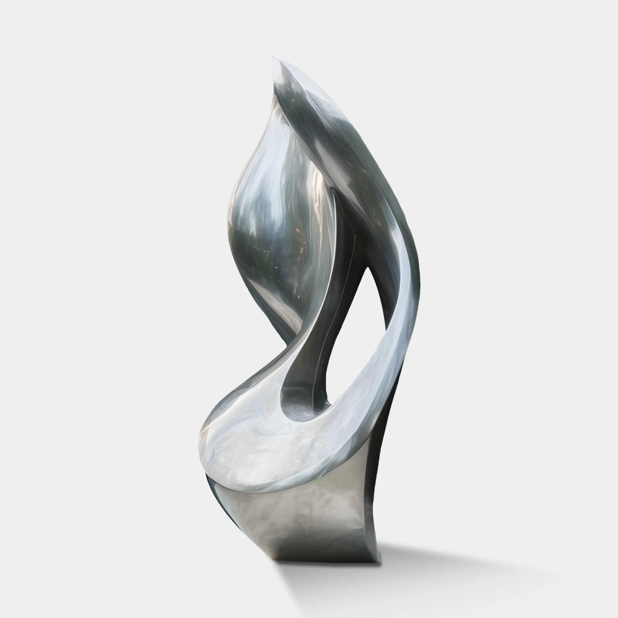 Tall twisted stainless steel abstract sculpture with brushed finish on white base in front of modern glass villa