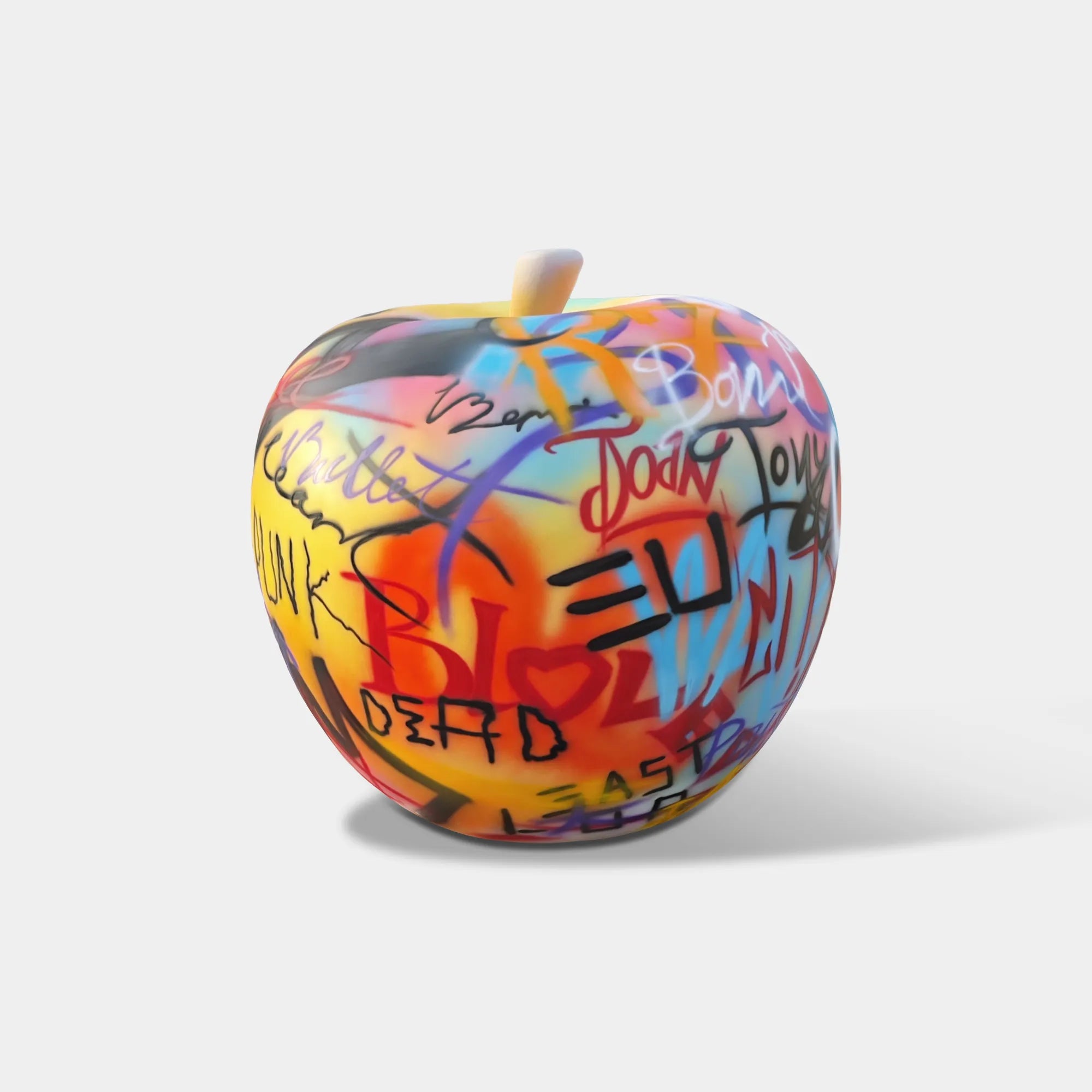 Graffiti apple stainless steel sculpture in an art gallery.
