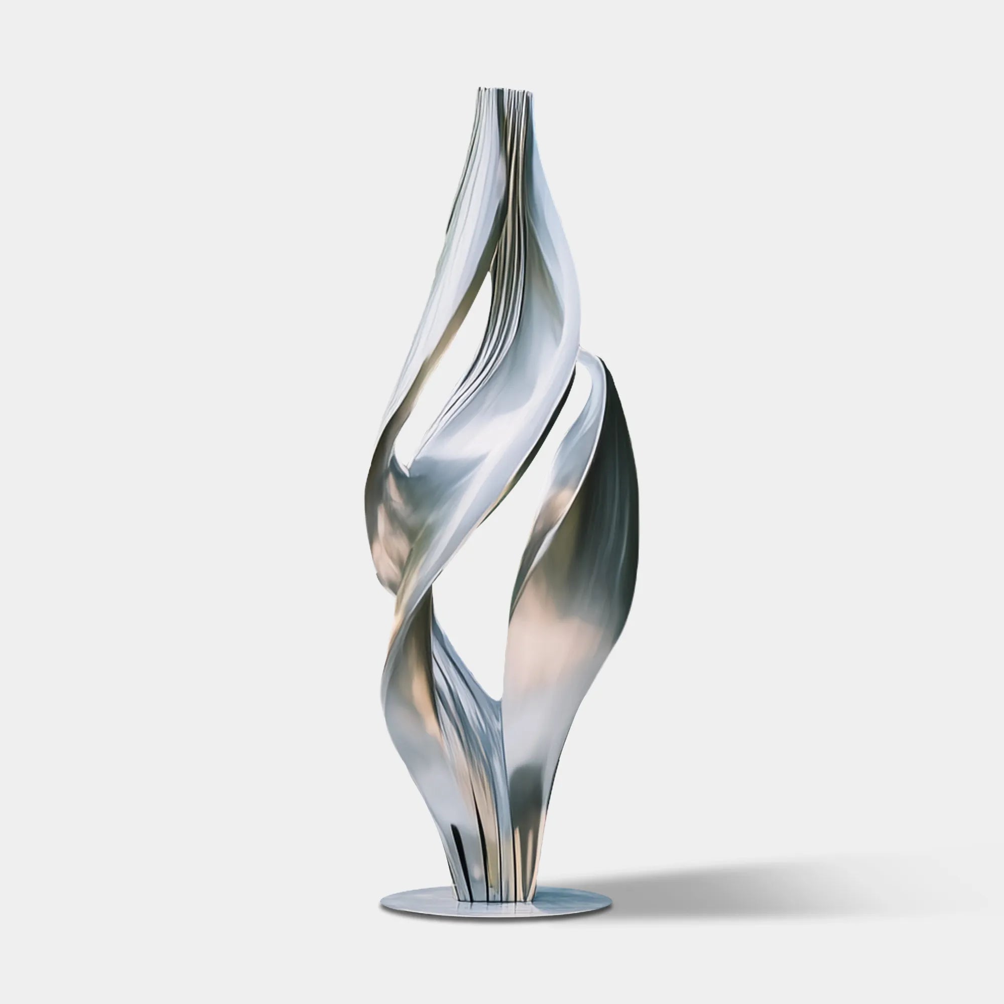 Abstract stainless steel sculpture in flowing form in a modern house patio.