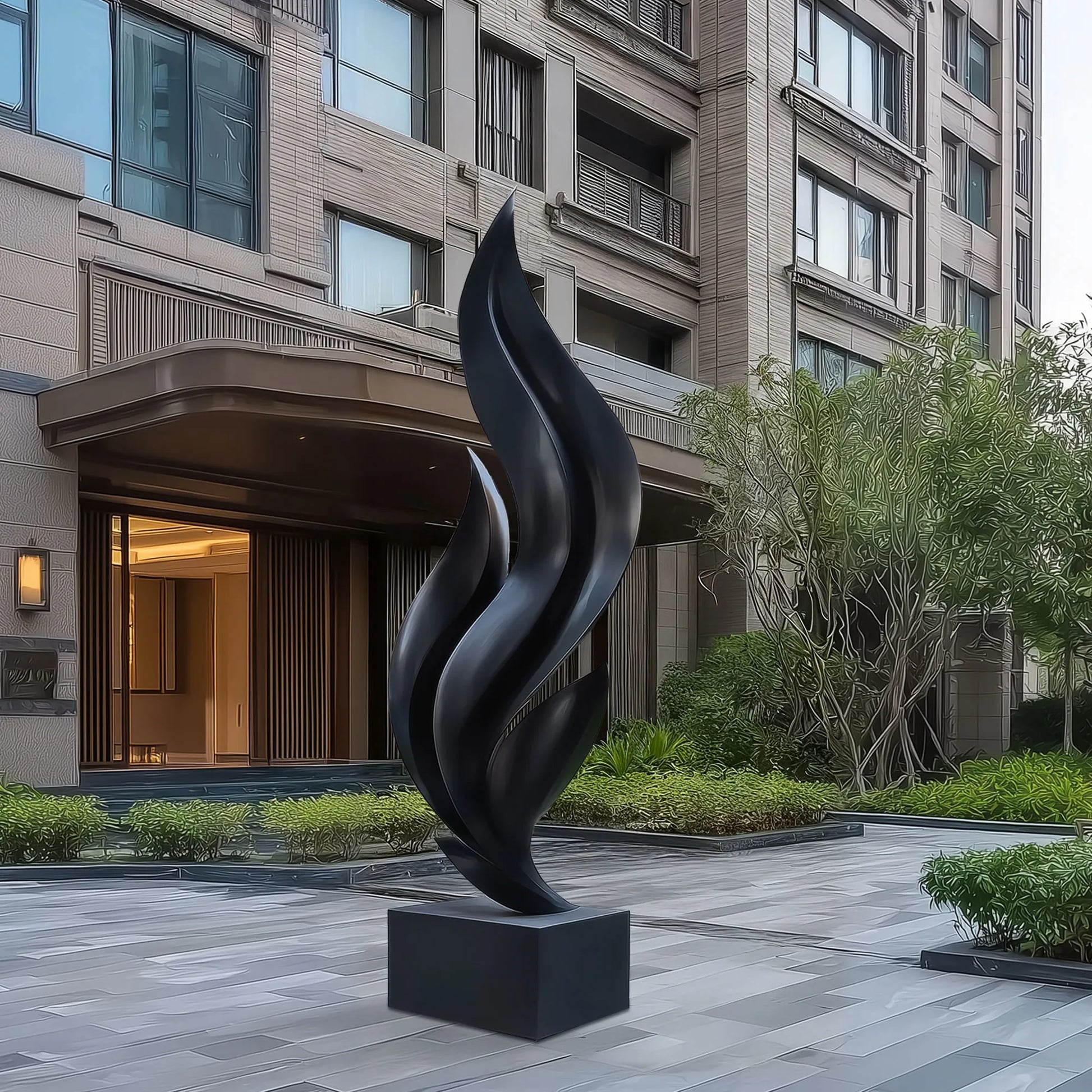 Stainless steel abstract sculpture with flowing vertical curves in courtyard in front of modern residential building.