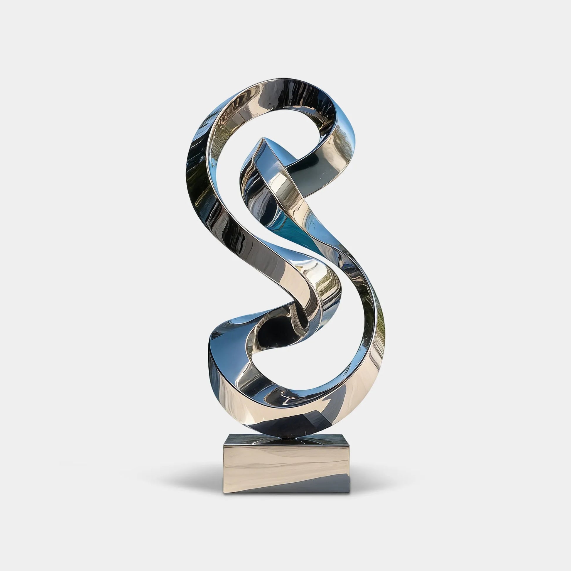 Mirrored stainless steel abstract sculpture on a modern villa terrace with mountain views.