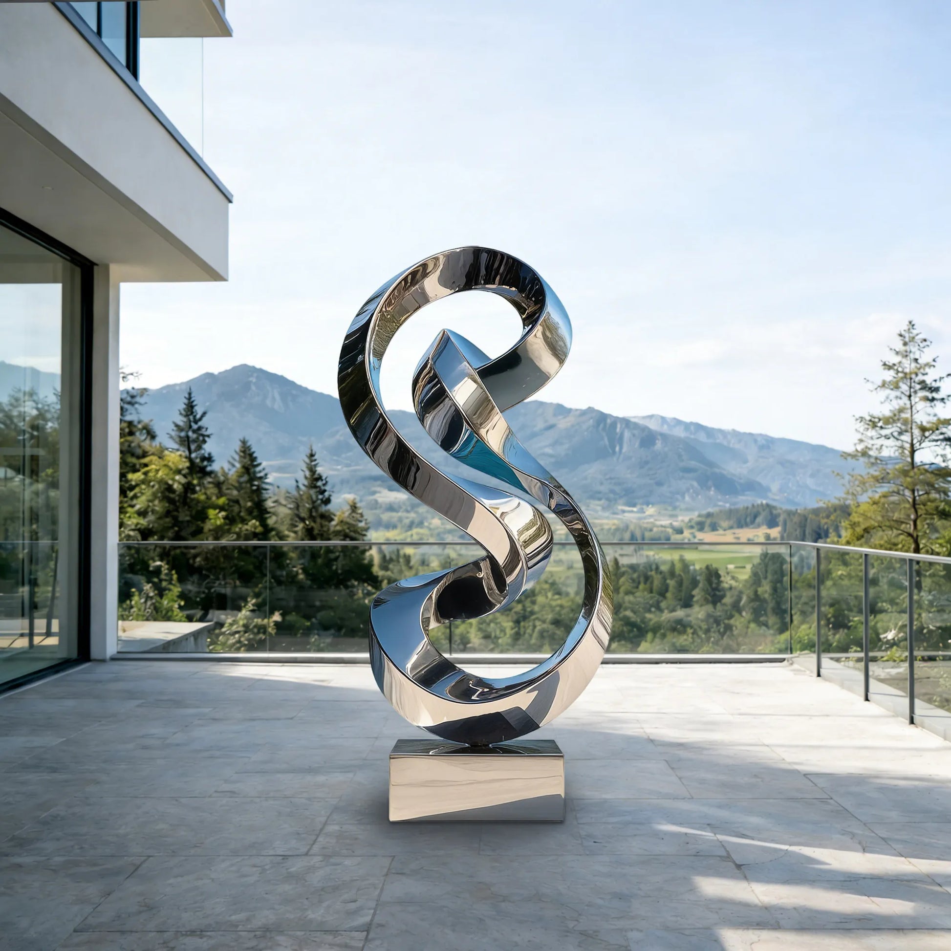 Mirrored stainless steel abstract sculpture on a modern villa terrace with mountain views.