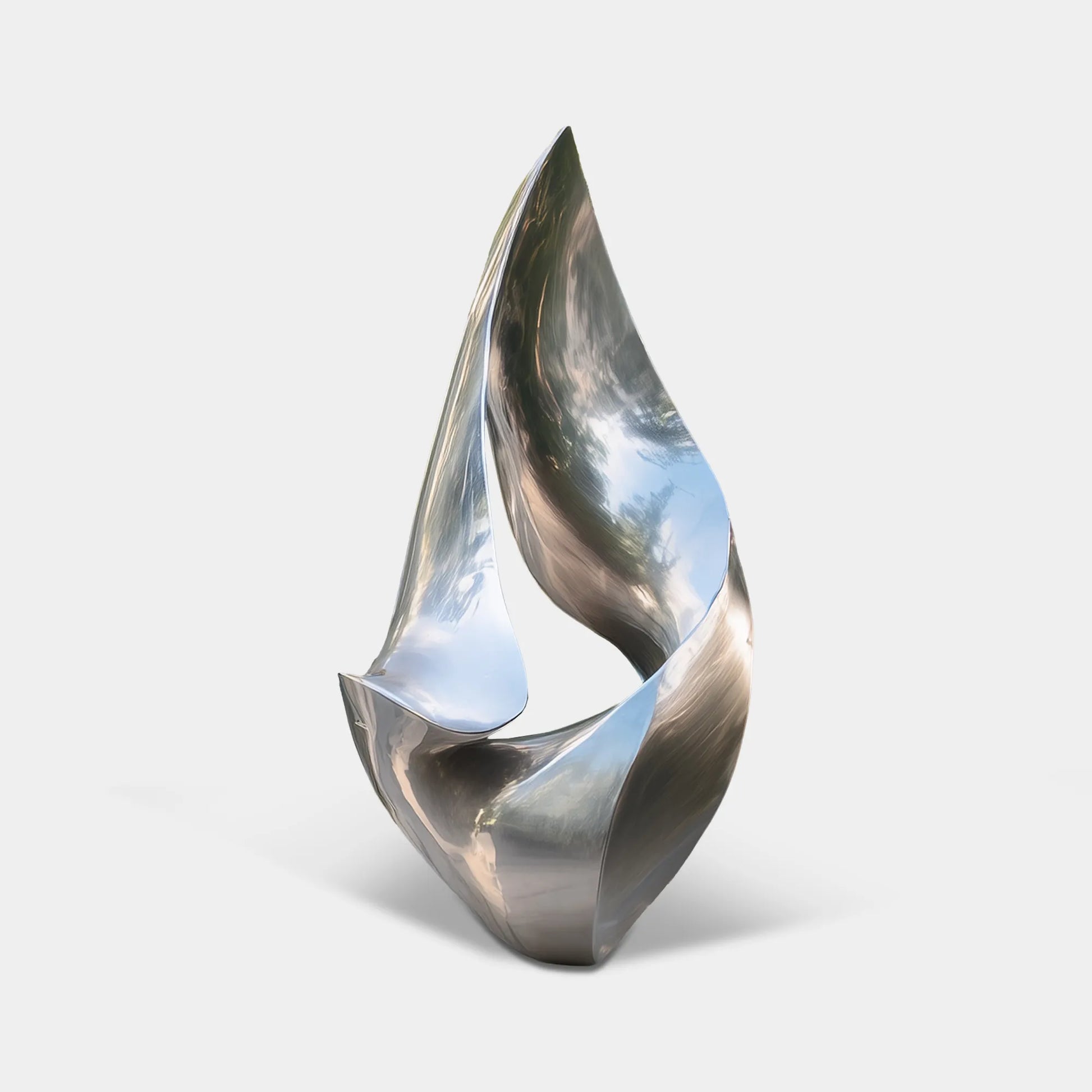Polished stainless steel abstract sculpture with flowing curved form in modern villa courtyard.
