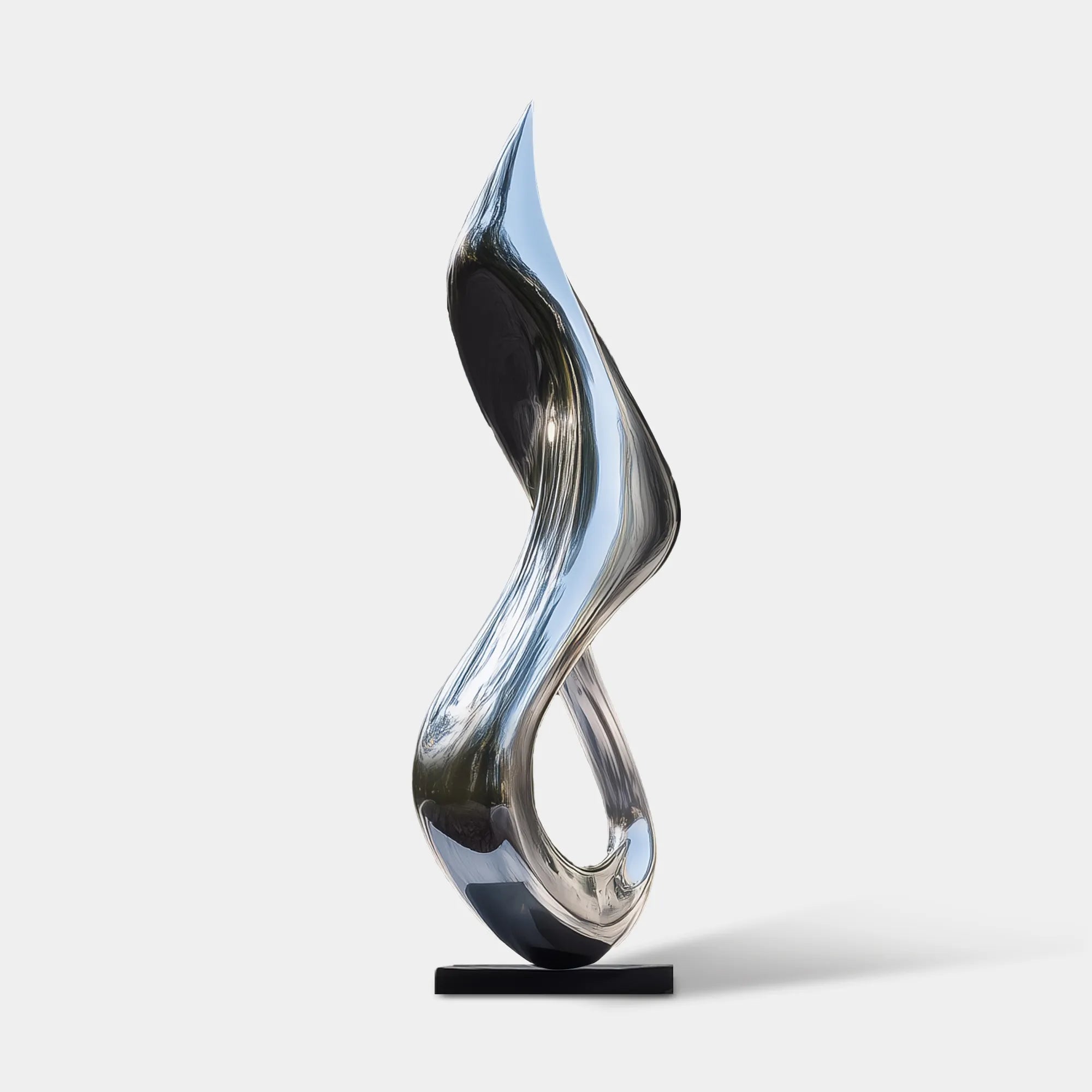 Polished stainless steel flowing form sculpture on a black pedestal in front of a modern glass residence.
