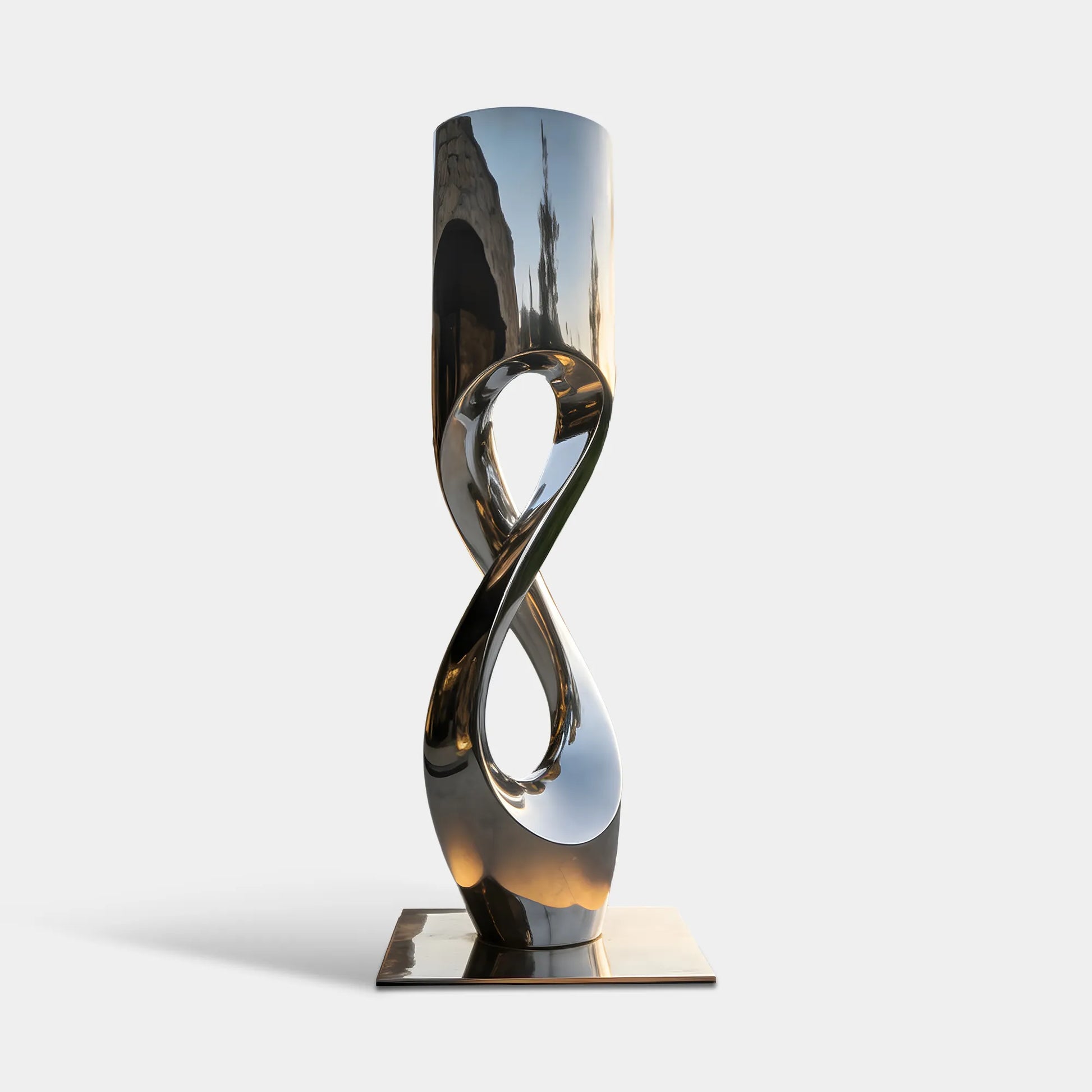 Mirror polished stainless steel abstract sculpture with intertwined open form in a modern residential courtyard.