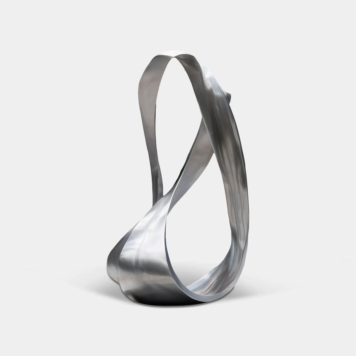 Brushed stainless steel flowing form sculpture with an open looping silhouette outside a contemporary glass villa.