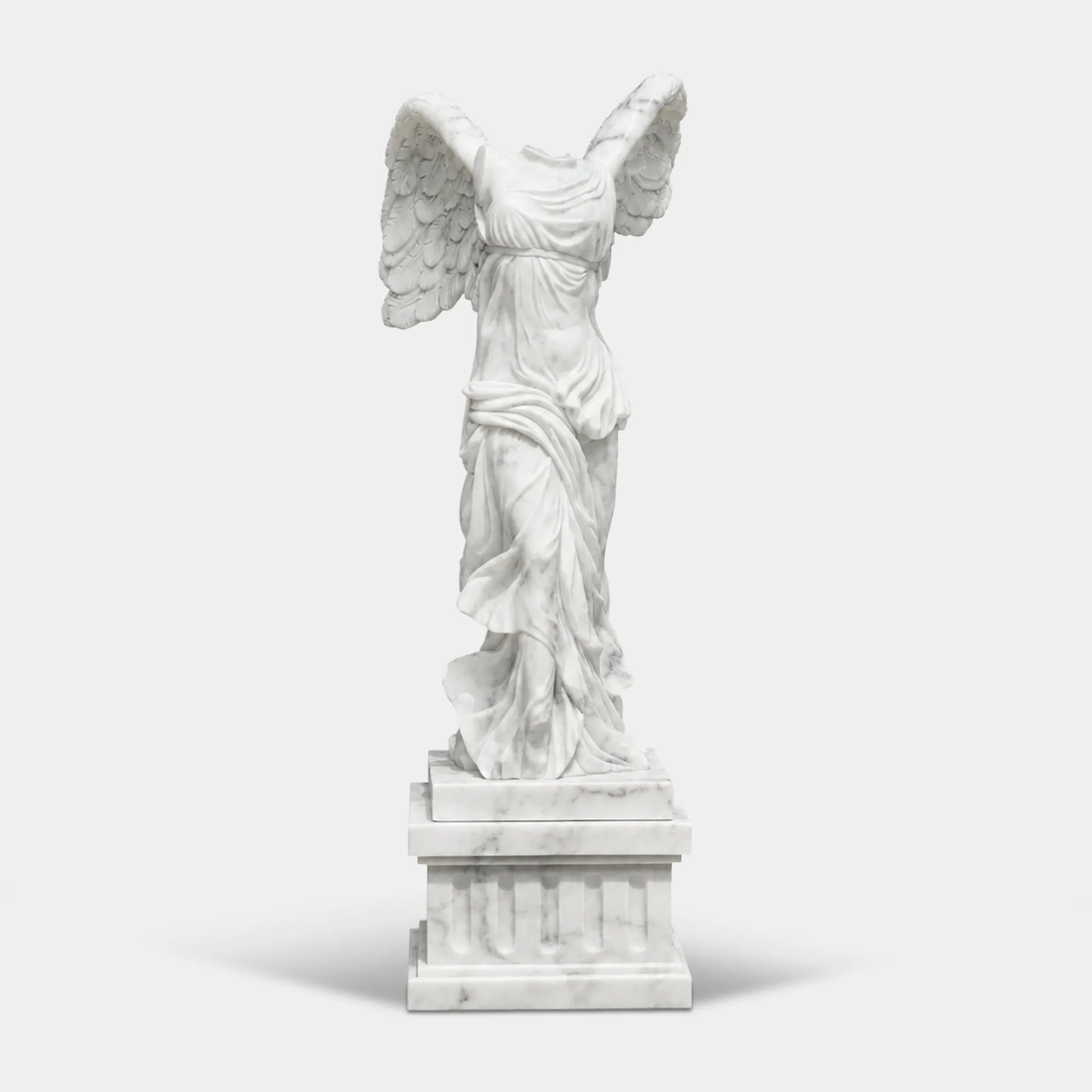 Classical marble sculpture of the Winged Victory of Samothrace with flowing drapery and soaring wings for luxury villas, courtyards, and art galleries.