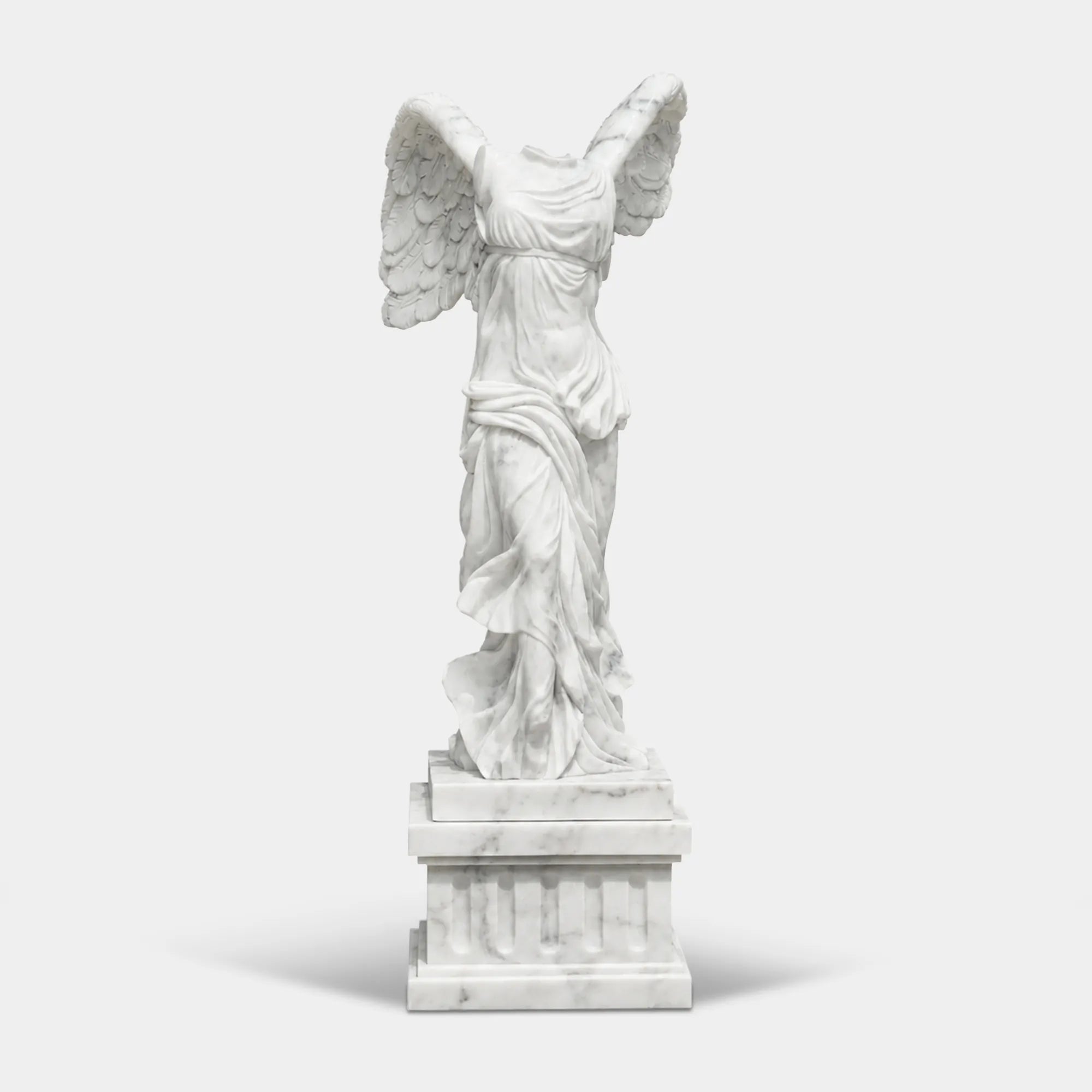 Classical marble sculpture of the Winged Victory of Samothrace with flowing drapery and soaring wings for luxury villas, courtyards, and art galleries.