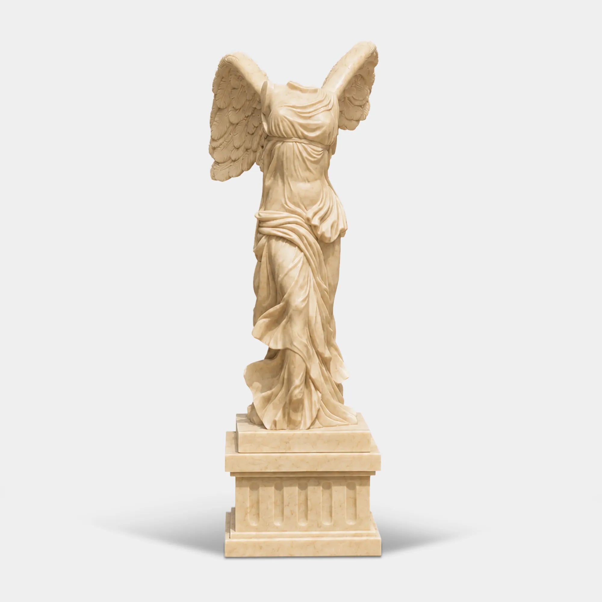 Classical marble sculpture of the Winged Victory of Samothrace with flowing drapery and soaring wings for luxury villas, courtyards, and art galleries.